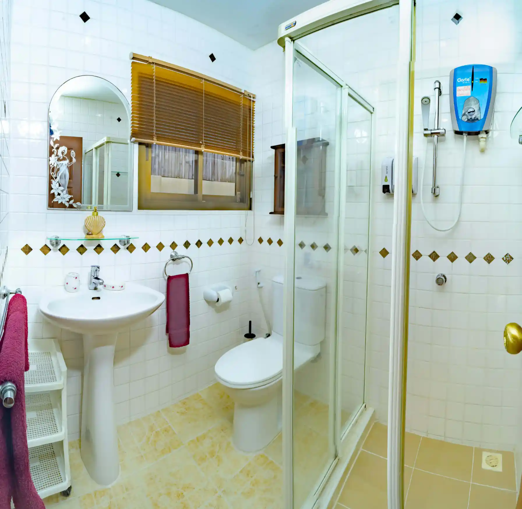 Bon Island Villa second bathroom with glass shower cubicle, basin and WC