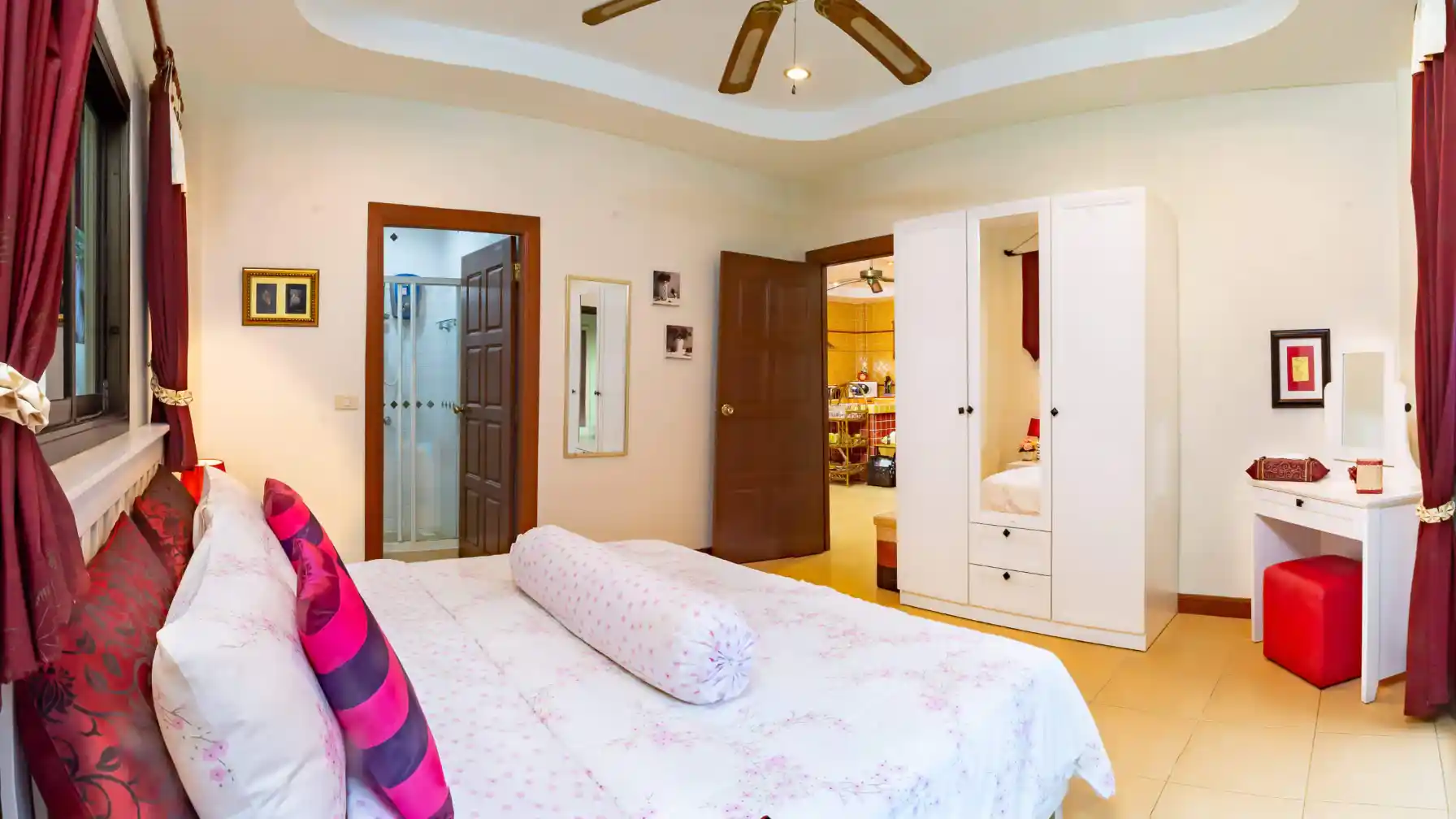 Bon Island Villa master bedroom with double bed and pool view through window