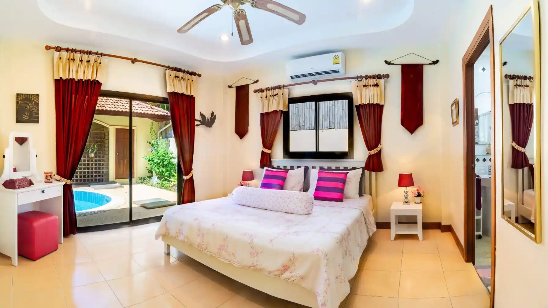 Bon Island Villa master bedroom interior with air conditioning and ceiling fan