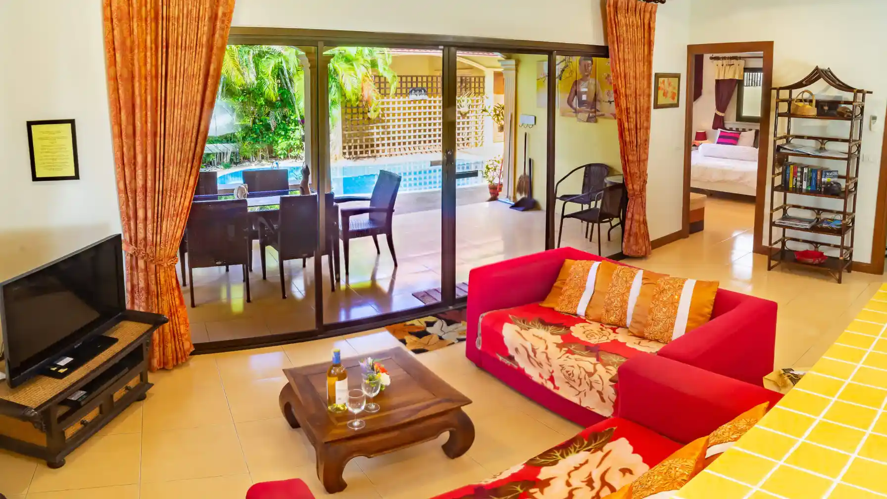 Bon Island Villa dining table and chairs with sliding doors to the garden