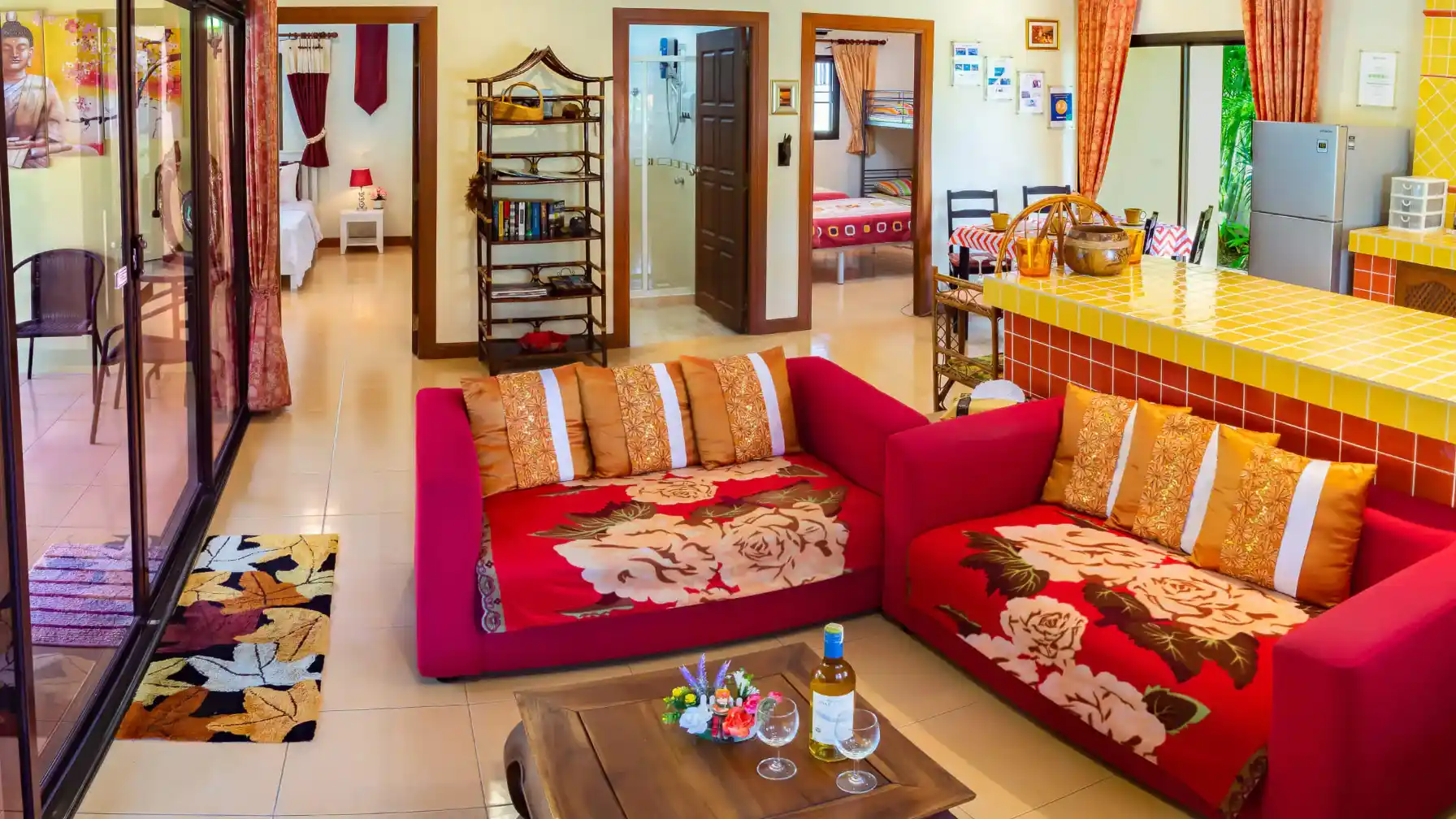 Bon Island Villa lounge with ceiling fan, Thai artwork and colourful decor