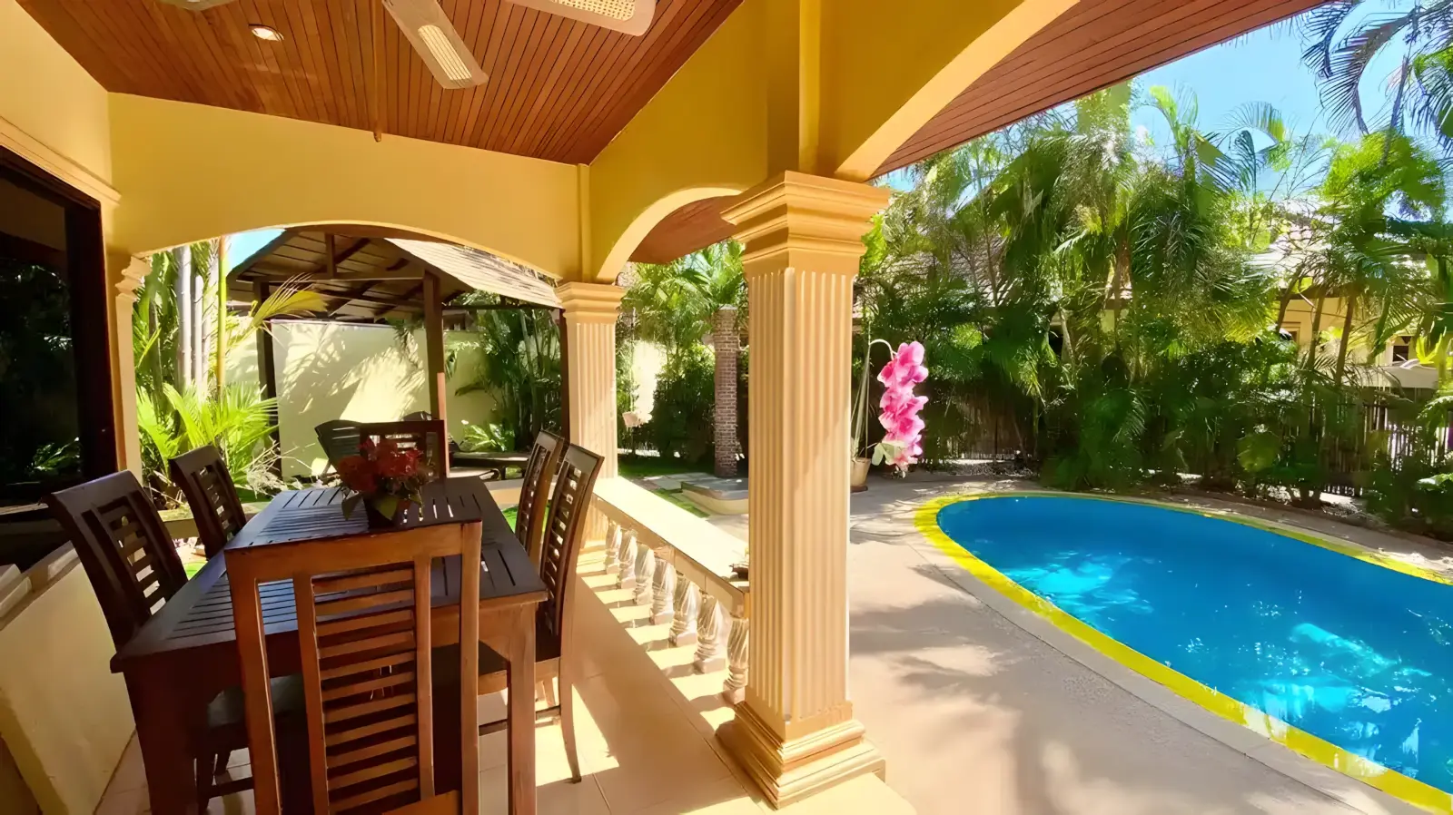 Coconut Paradise Villa outdoor patio at dusk