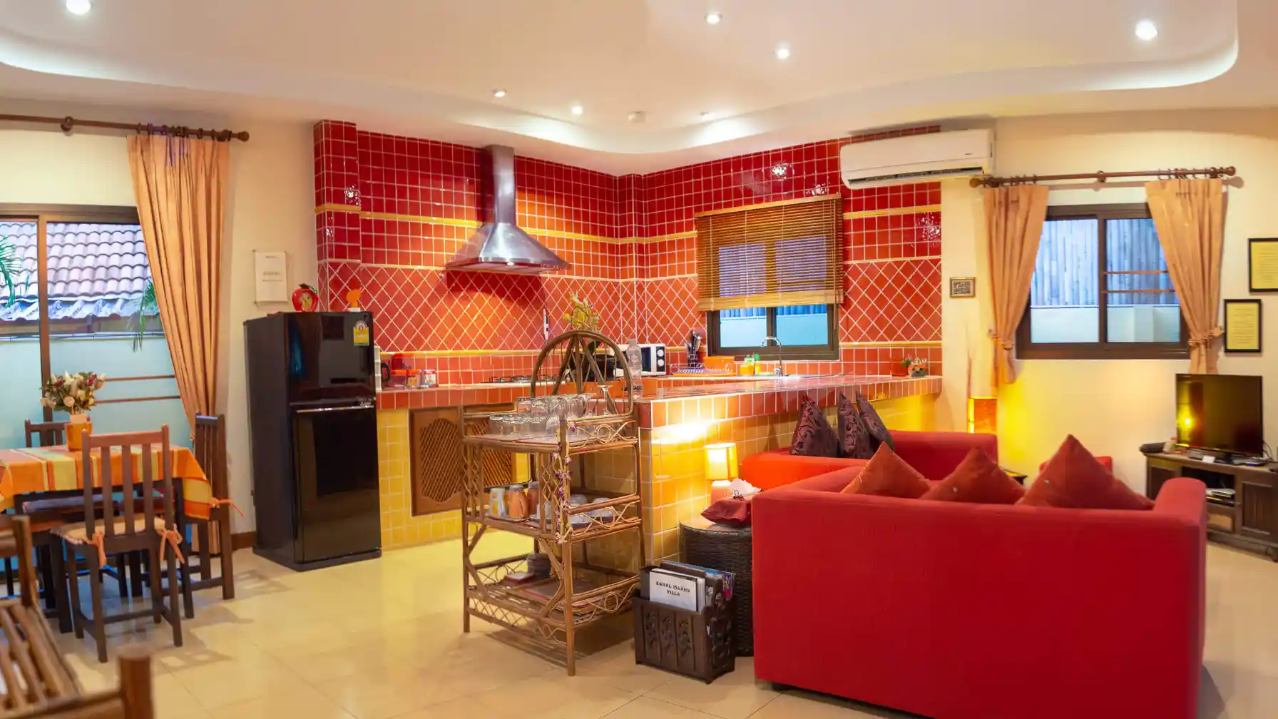 Coral Island Villa living room seating area with air conditioning and ceiling fan