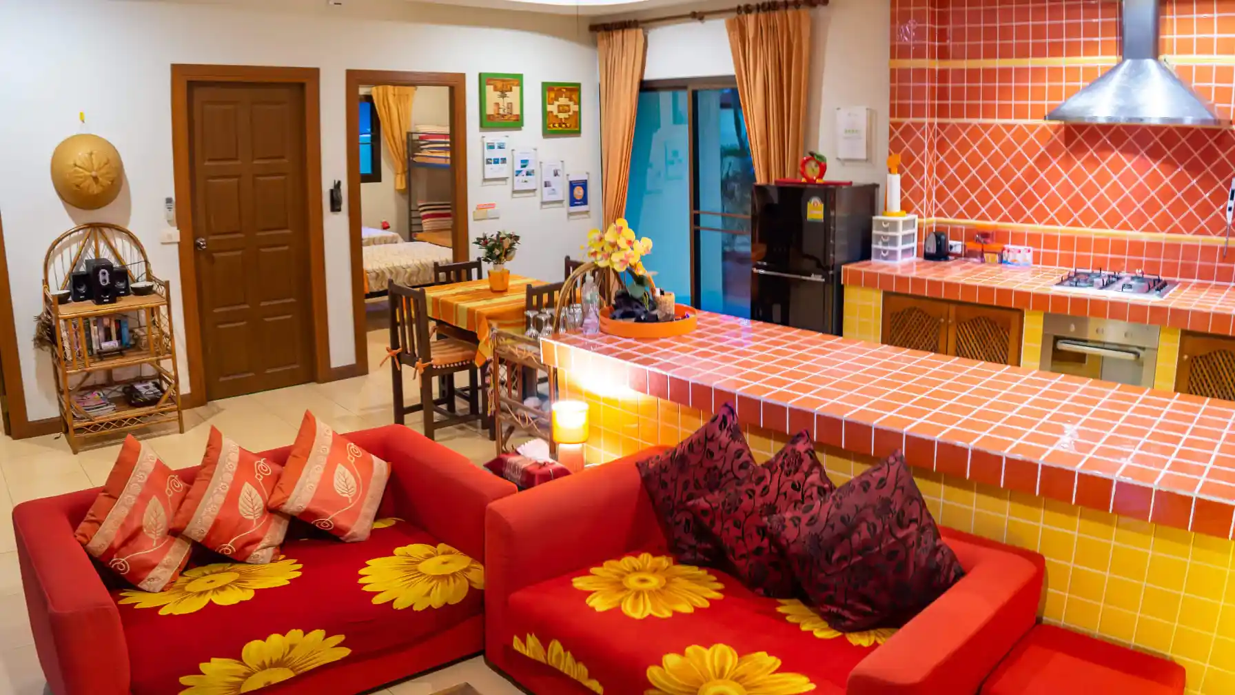 Coral Island Villa open-plan living area with patio doors and colourful Thai decor
